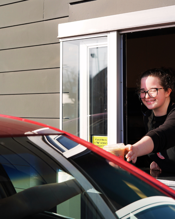 Five Lakes team member serving a guest